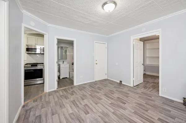 a view of a kitchen with wooden floor and a kitchen