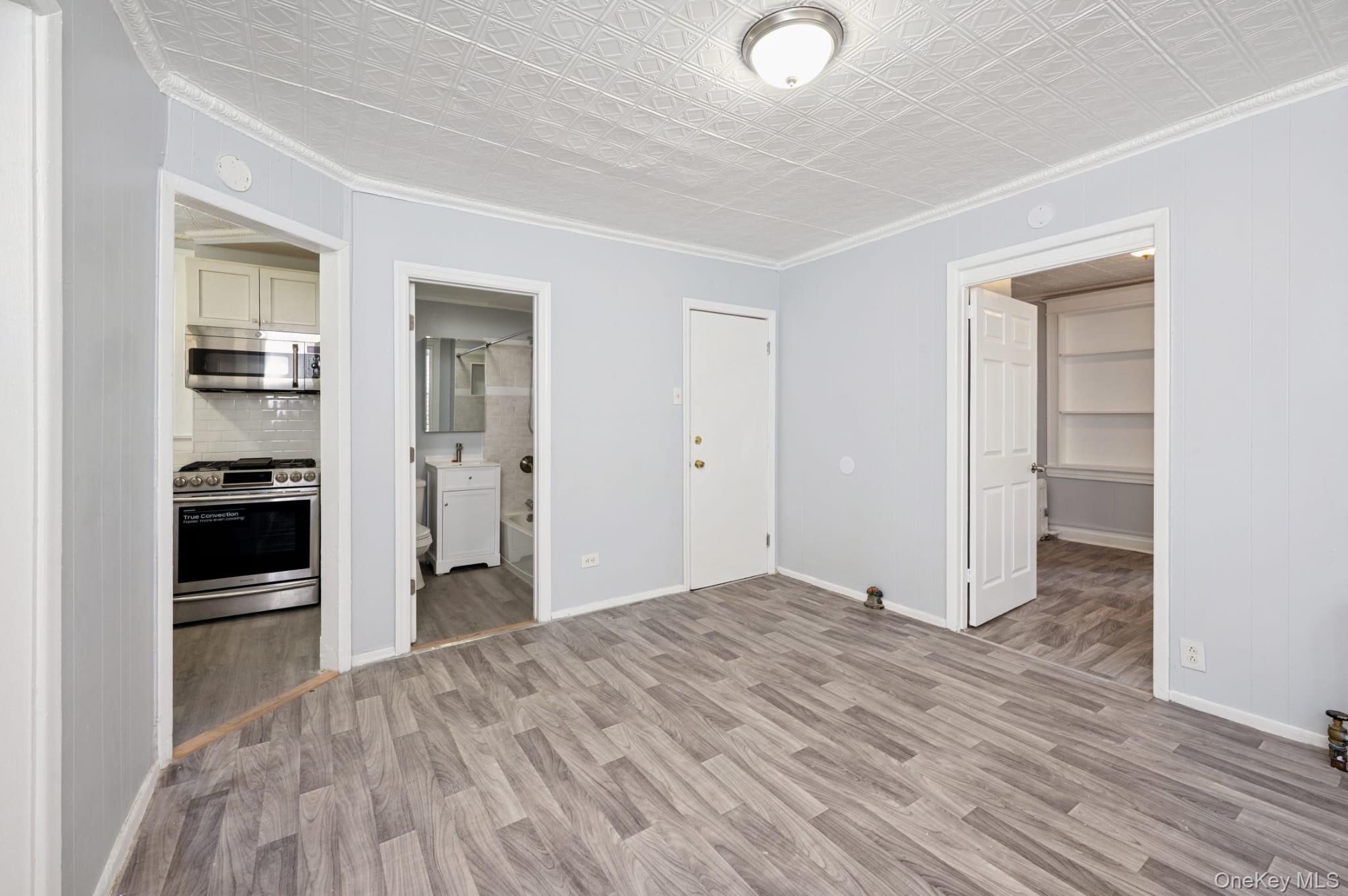 611 St Lawrence Avenue, Unit 1 Bronx, NY 10473 - Photo 18 of 20 a view of a kitchen with wooden floor and a kitchen