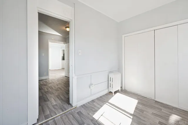 a picture of a bench in front of a wall