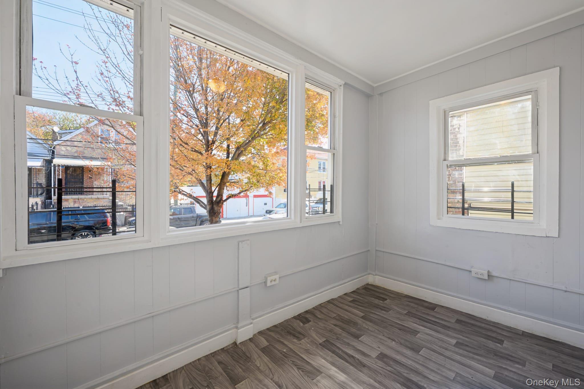 611 St Lawrence Avenue, Unit 1 Bronx, NY 10473 - Photo 6 of 20 a view of empty room with wooden floor and fan