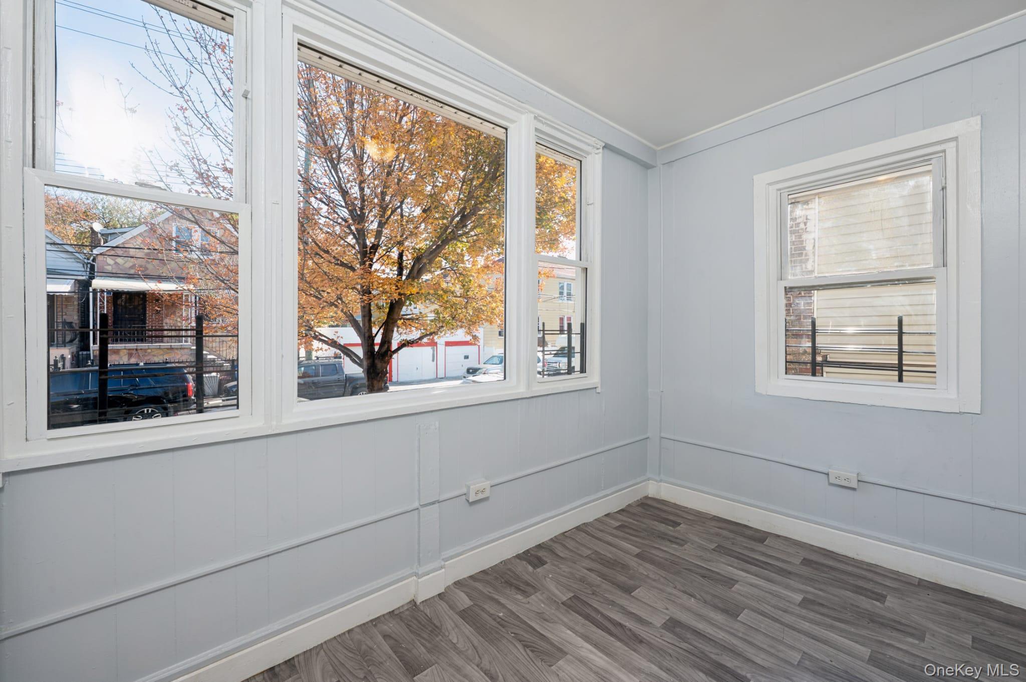 611 St Lawrence Avenue, Unit 1 Bronx, NY 10473 - Photo 7 of 20 a view of empty room with wooden floor and fan