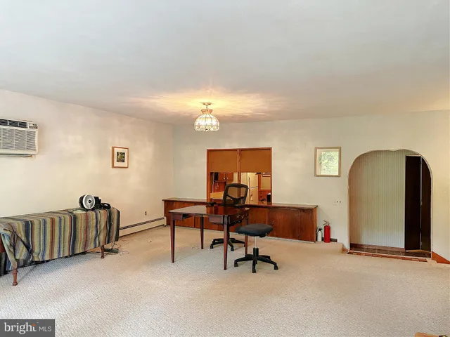 a bathroom with a sink a toilet a mirror and shower