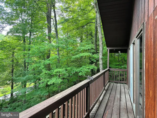 a view of balcony with wooden floor