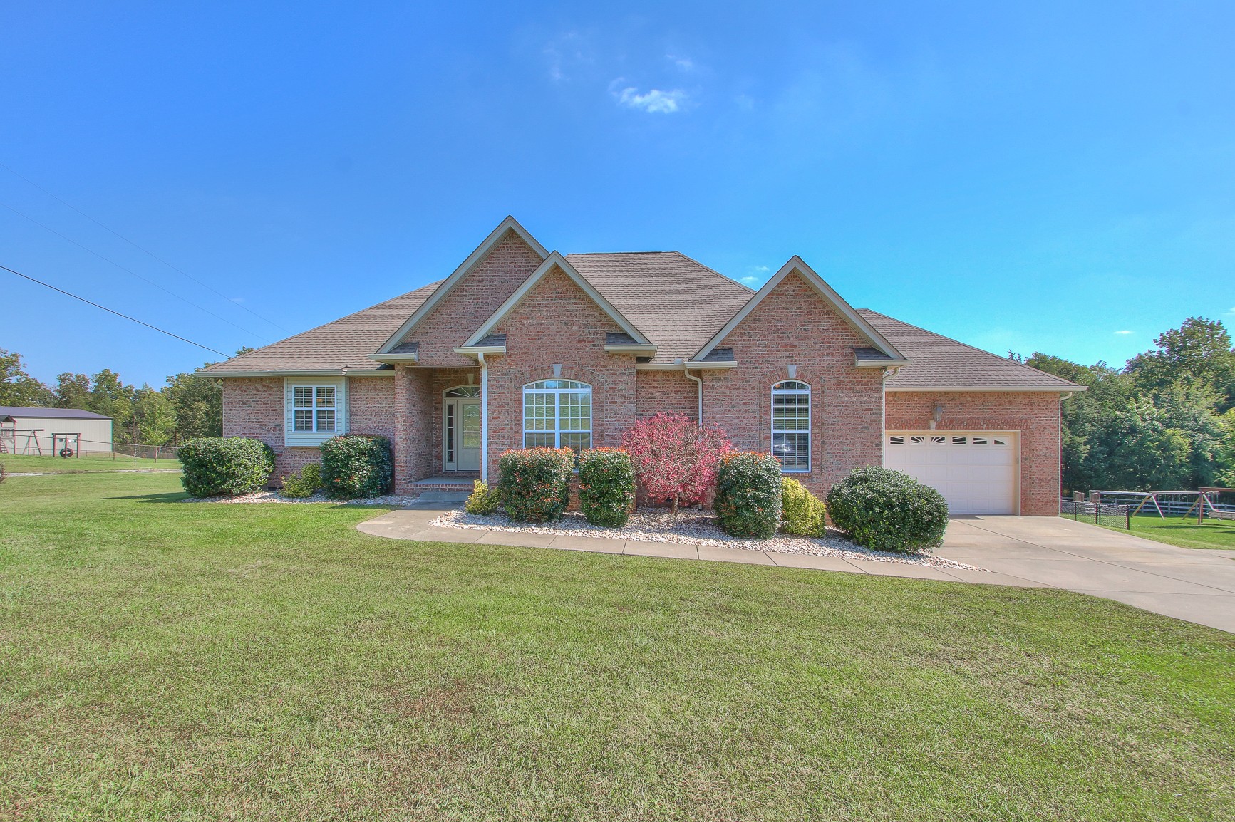 773 Sugar Flat Road Lebanon, TN 37087 - Photo 2 of 41 a front view of a house with a yard