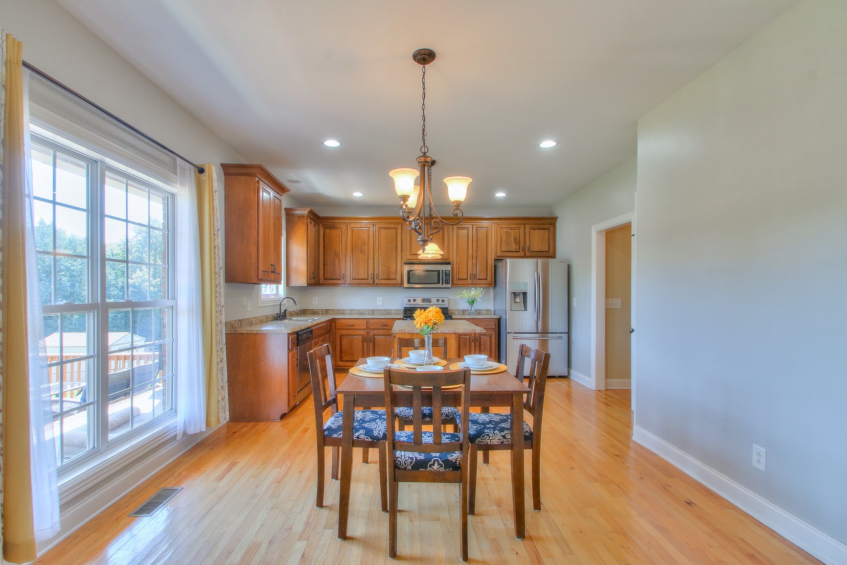 773 Sugar Flat Road Lebanon, TN 37087 - Photo 13 of 41 a view of a dining room with furniture window and wooden floor