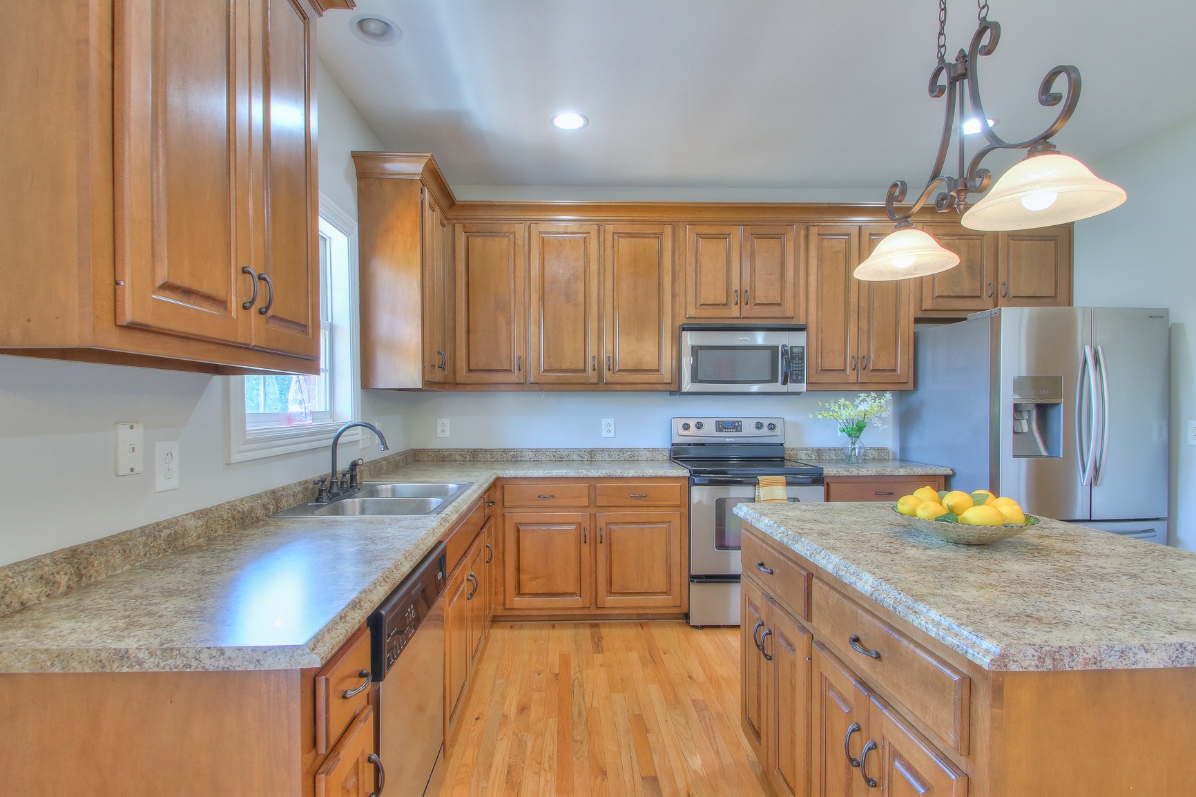773 Sugar Flat Road Lebanon, TN 37087 - Photo 15 of 41 a kitchen with a sink a counter top space cabinets and stainless steel appliances
