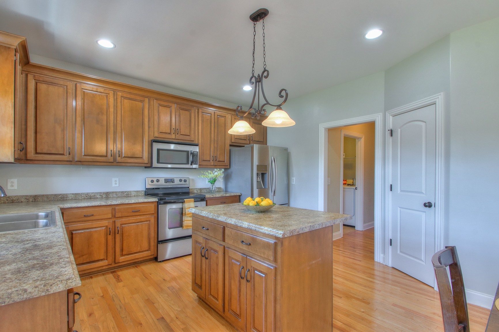 773 Sugar Flat Road Lebanon, TN 37087 - Photo 16 of 41 a kitchen with stainless steel appliances granite countertop wooden cabinets a sink a stove a refrigerator and island