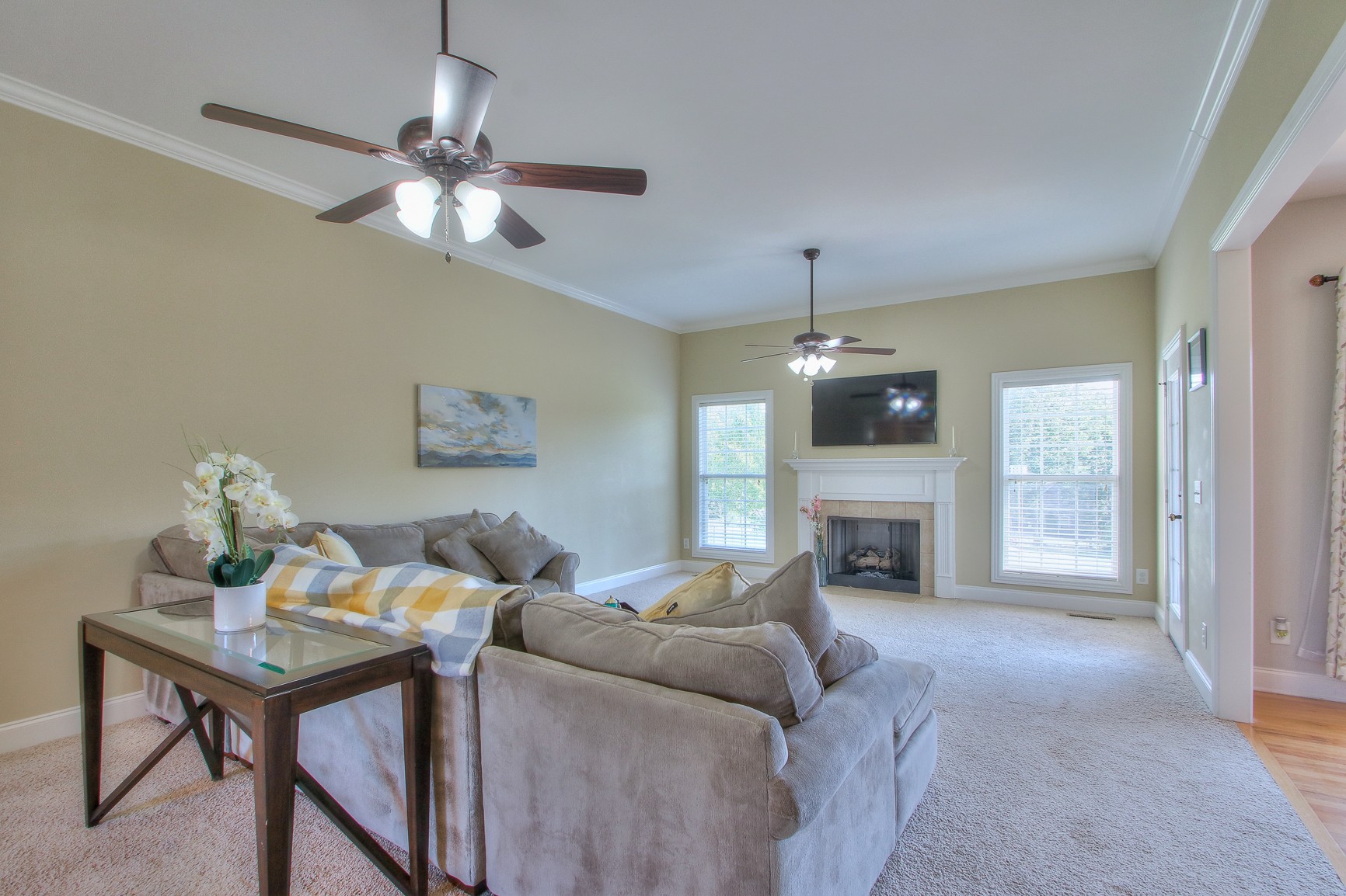 773 Sugar Flat Road Lebanon, TN 37087 - Photo 21 of 41 a living room with furniture a fireplace and a chandelier