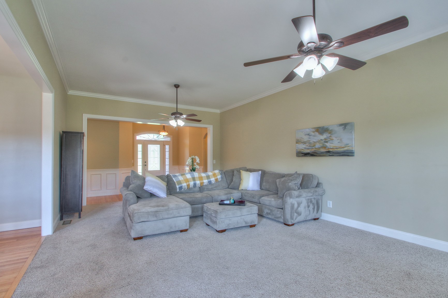 773 Sugar Flat Road Lebanon, TN 37087 - Photo 23 of 41 a living room with furniture and a chandelier