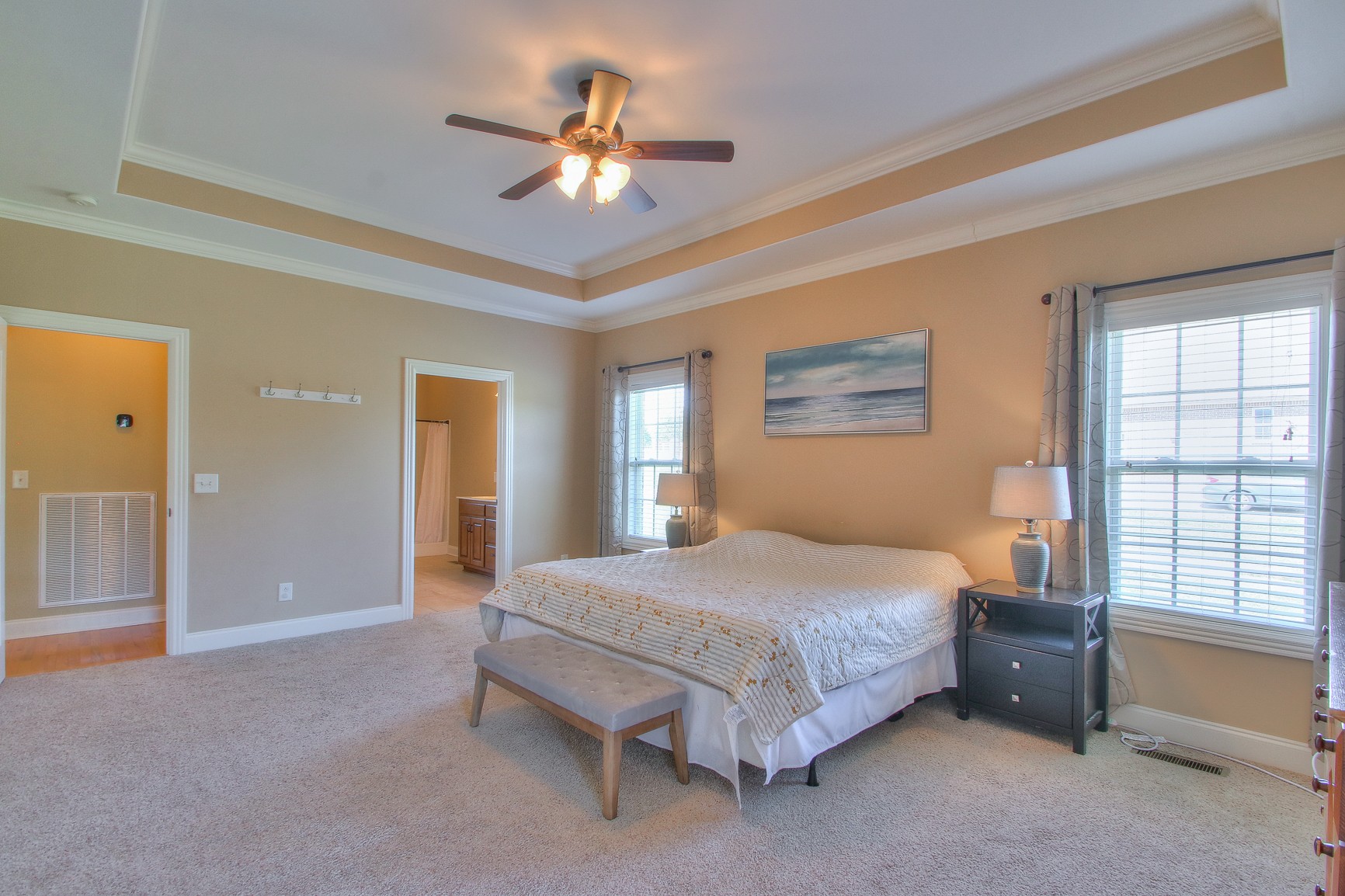 773 Sugar Flat Road Lebanon, TN 37087 - Photo 25 of 41 a bedroom with a bed and a chandelier