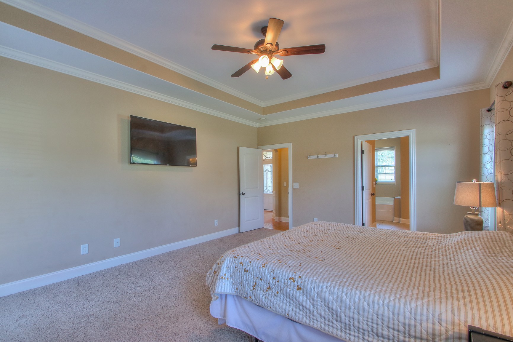 773 Sugar Flat Road Lebanon, TN 37087 - Photo 27 of 41 a bedroom with a large bed chandelier and a window