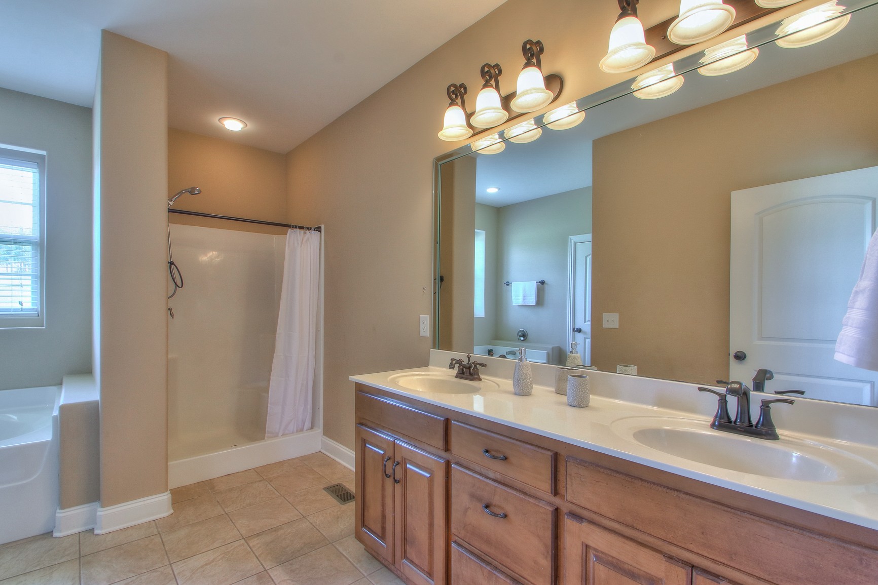 773 Sugar Flat Road Lebanon, TN 37087 - Photo 29 of 41 a bathroom with a double vanity sink mirror and shower