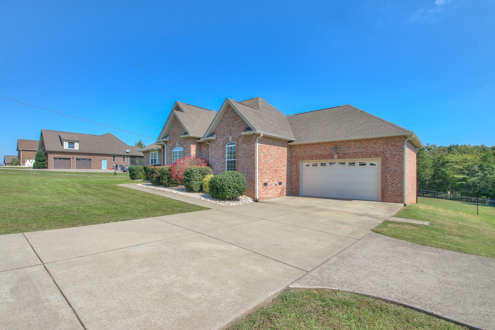 773 Sugar Flat Road Lebanon, TN 37087 - Photo 4 of 41 a front view of a house with a yard and garage