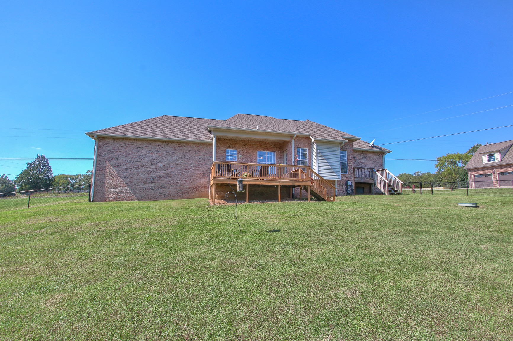 773 Sugar Flat Road Lebanon, TN 37087 - Photo 7 of 41 a front view of a house with a garden and porch