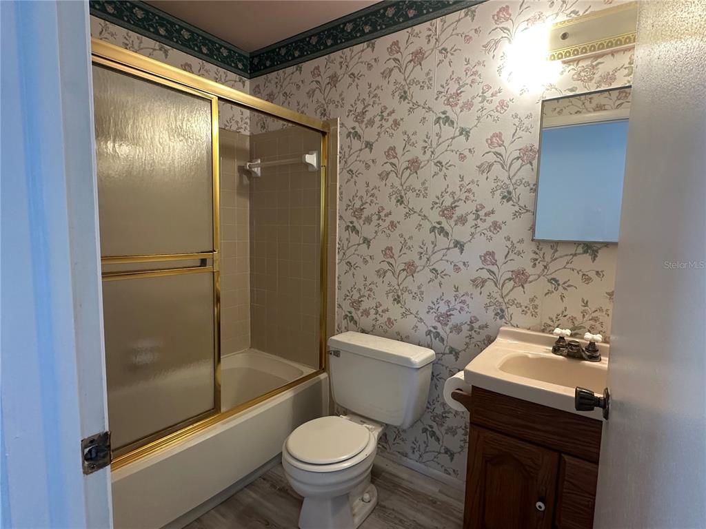 8100 Pickwick Road North Port, FL 34287 - Photo 12 of 15 a bathroom with a sink toilet and shower