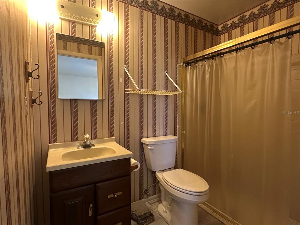 8100 Pickwick Road North Port, FL 34287 - Photo 5 of 15 a bathroom with a sink a toilet and shower