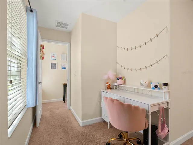 a workspace with furniture and window