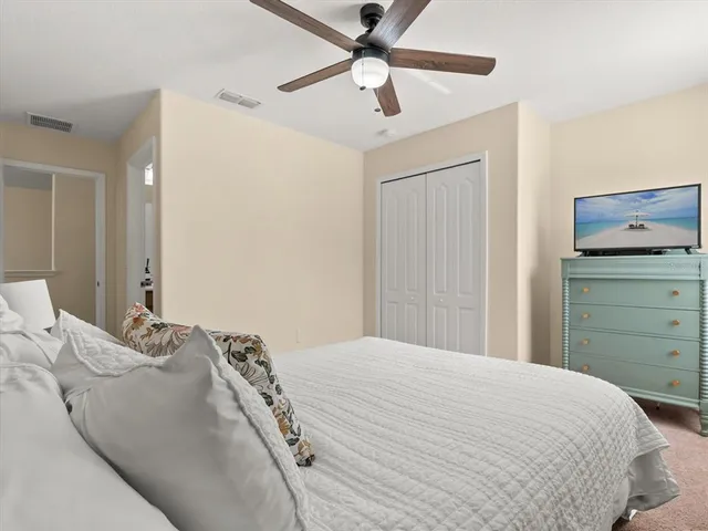 a bedroom with a bed and a dresser