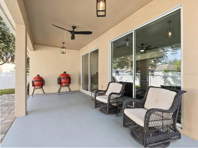 a view of a porch with furniture and garden