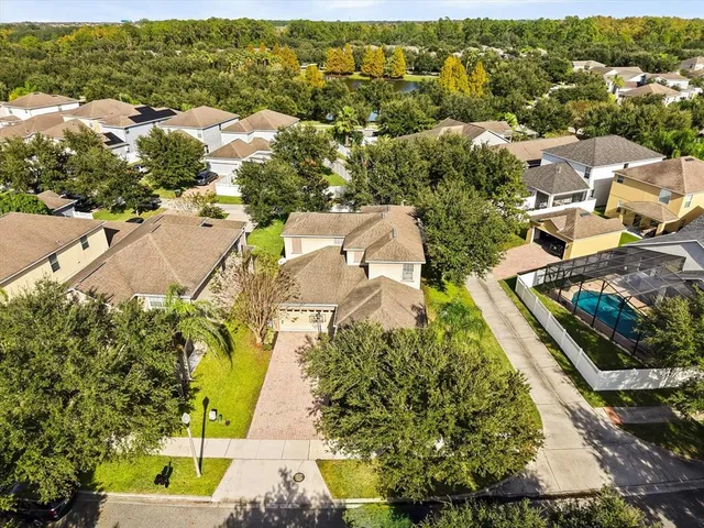 an aerial view of residential houses with outdoor space