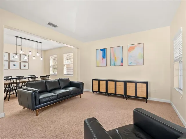 a living room with furniture window and a couch