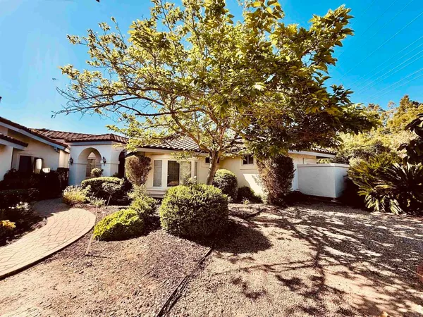 a view of a front of a house with a yard