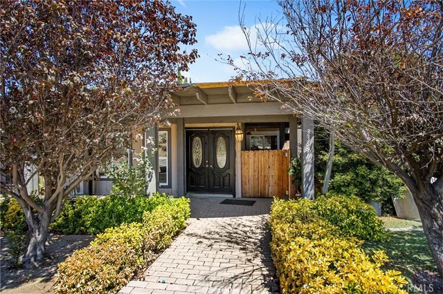 a front view of a house with yard
