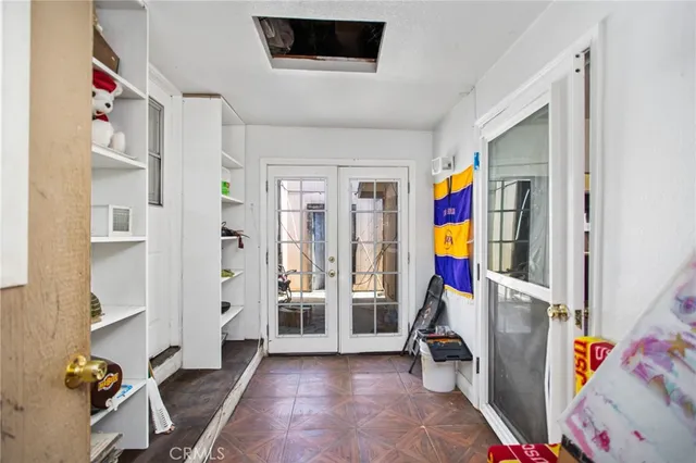 a view of a kitchen with a sink and cabinets