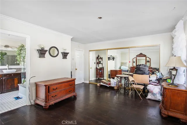 a bathroom with a granite countertop sink a large mirror and a shower