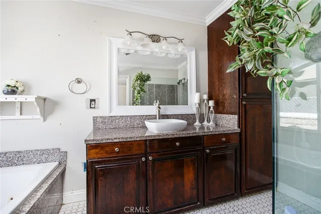 a bathroom with a tub shower and mirror