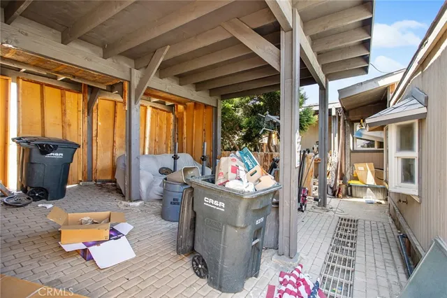 an aerial view of residential houses with city view