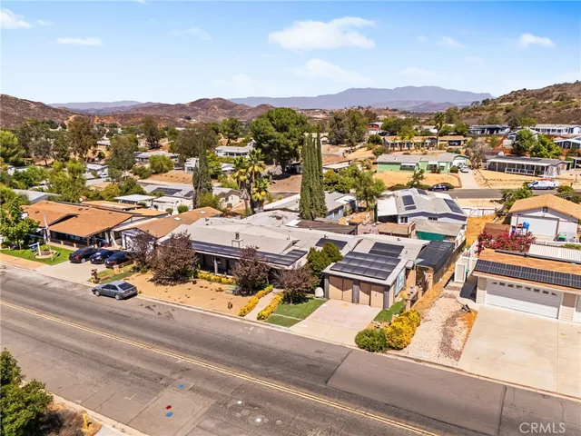 a view of swimming pool with outdoor seating and plants
