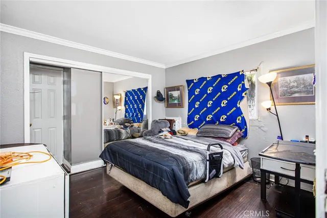 a bedroom with a bed and a table in it