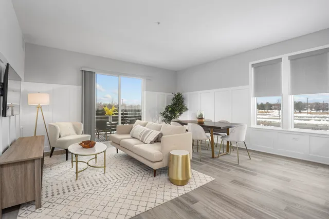 a living room with furniture and a table