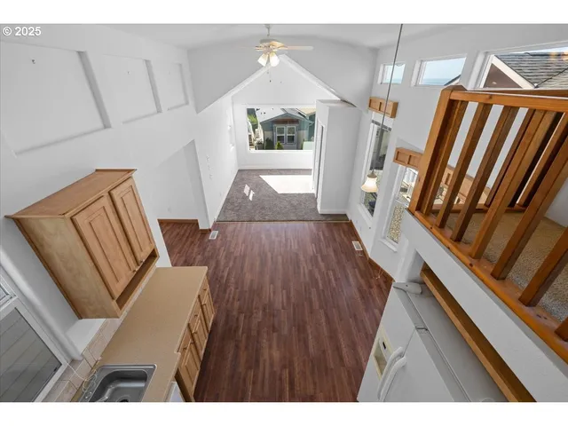 a view of living room and wooden floor