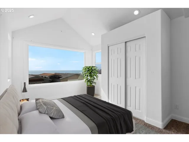 a bedroom with a bed and a painting on the wall