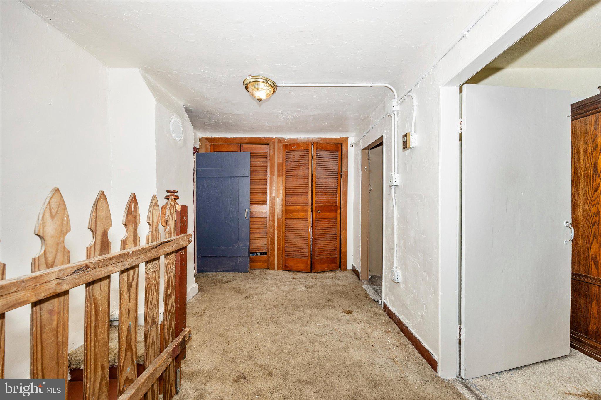 14721 Albert Staub Road Thurmont, MD 21788 - Photo 30 of 46 a view of a hallway with wooden shelves