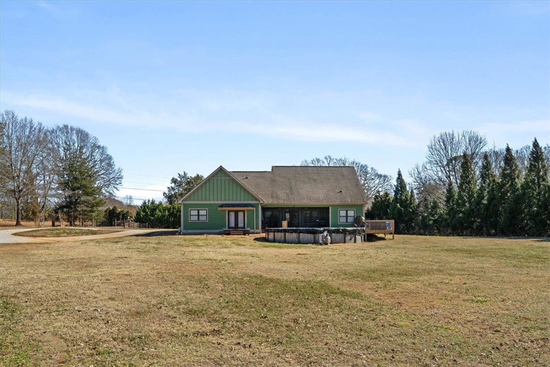 212 Winding Lane Seneca, SC 29672 - Photo 35 of 47 This verdant home boasts a sprawling yard, an inviting pool, and a cozy deck.