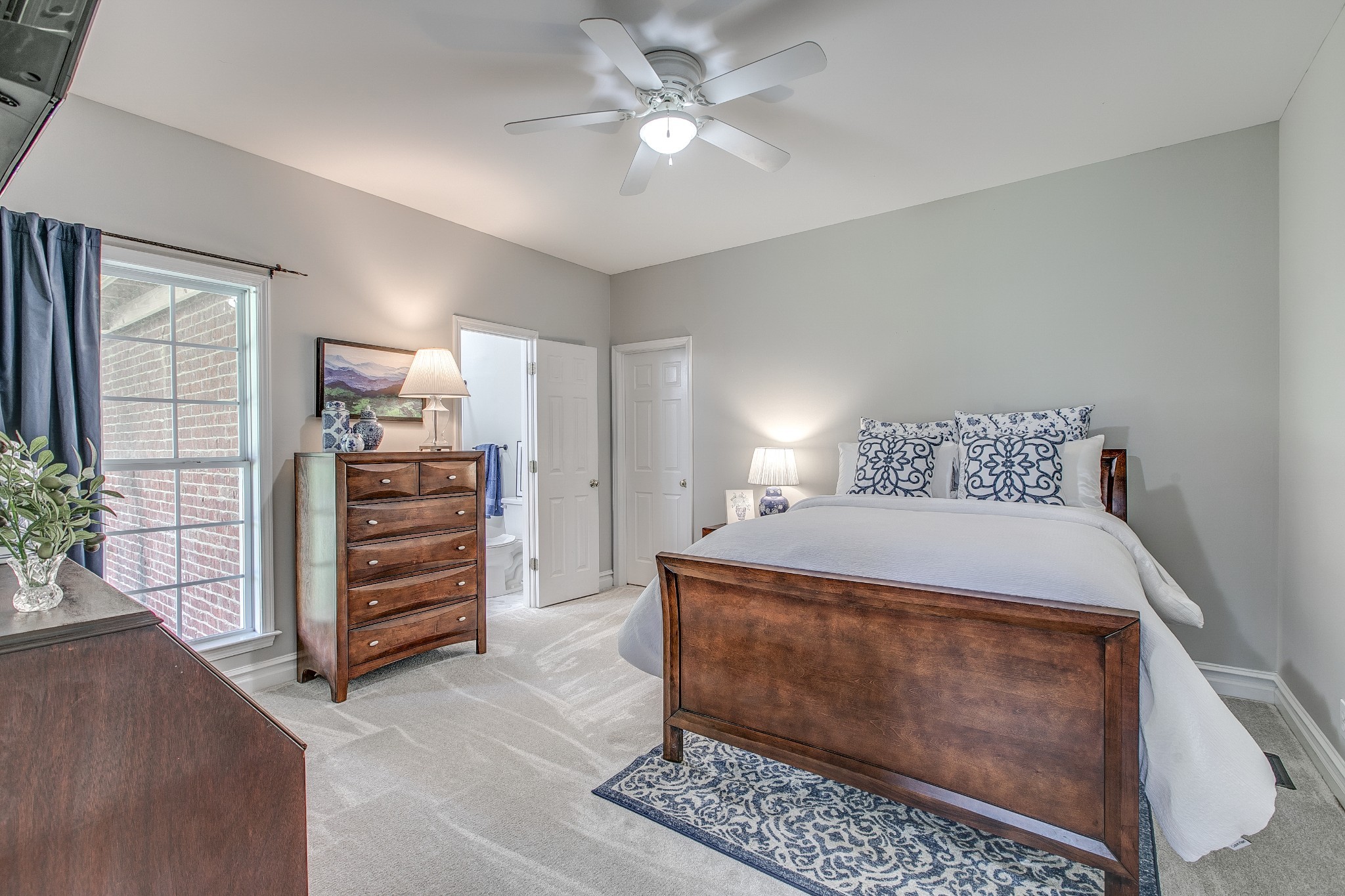 7285 North Milton Road Milton, TN 37118 - Photo 34 of 58 a bedroom with a bed and a chandelier