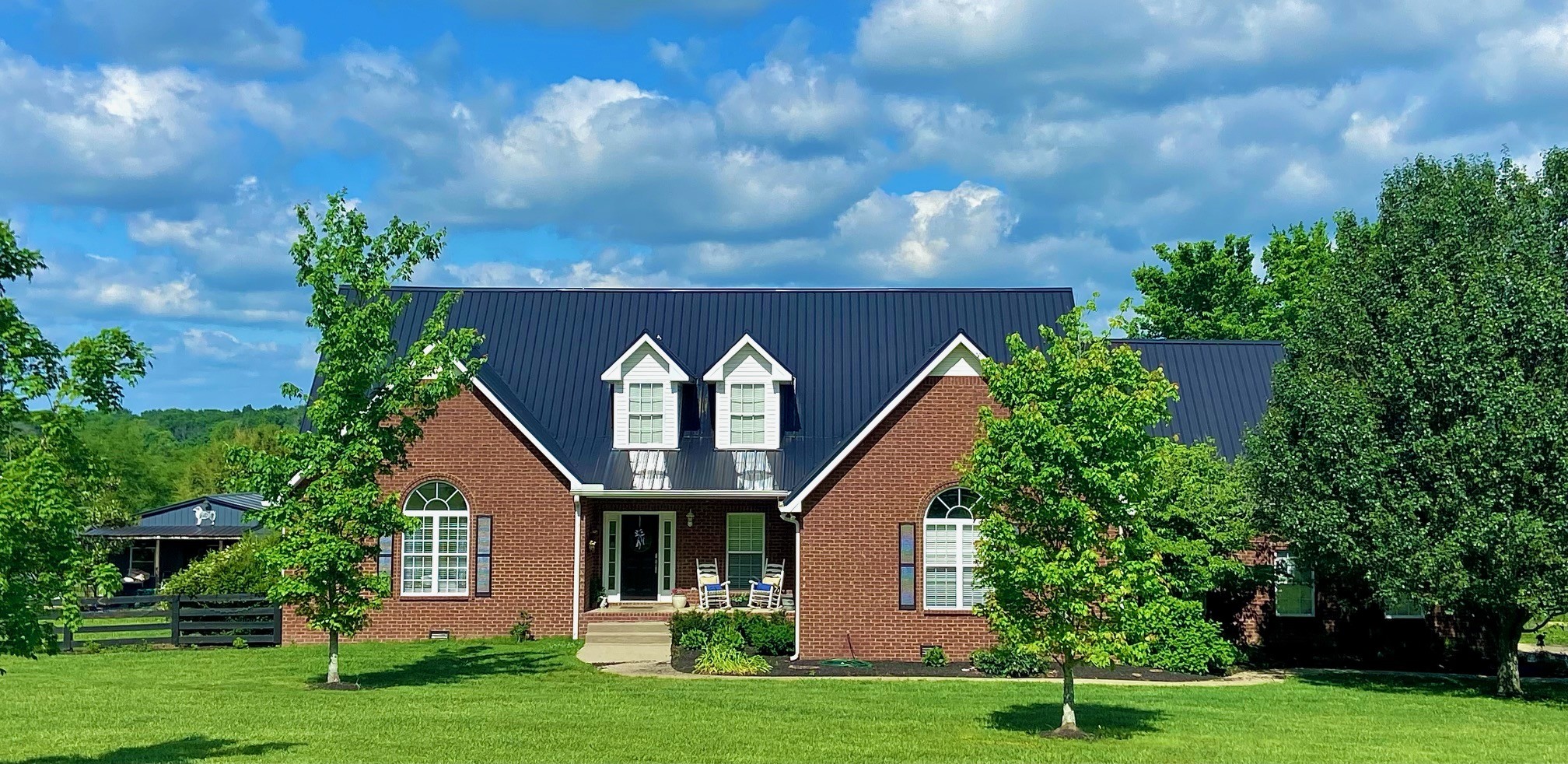 7285 North Milton Road Milton, TN 37118 - Photo 4 of 58 a front view of a house with a yard