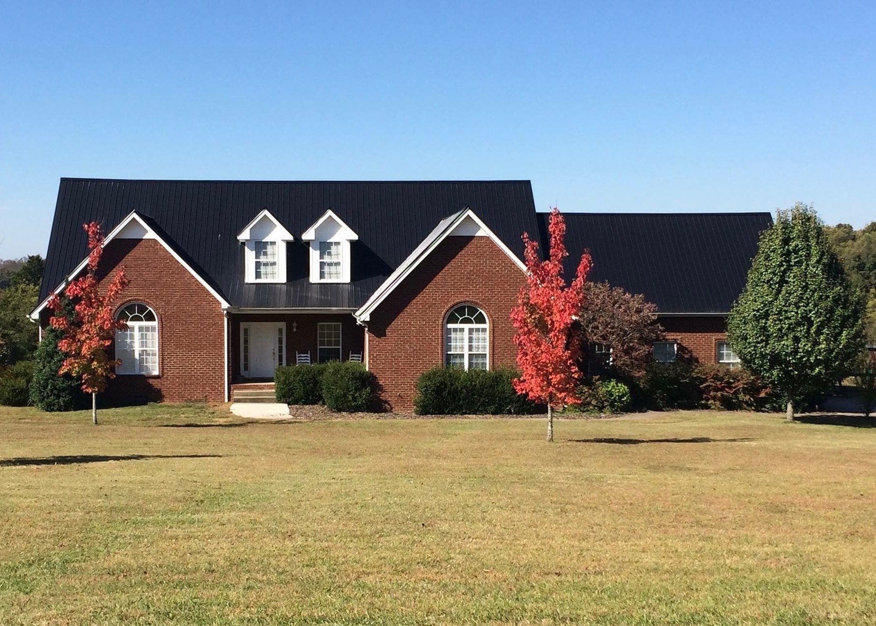 7285 North Milton Road Milton, TN 37118 - Photo 55 of 58 a front view of a house with a yard