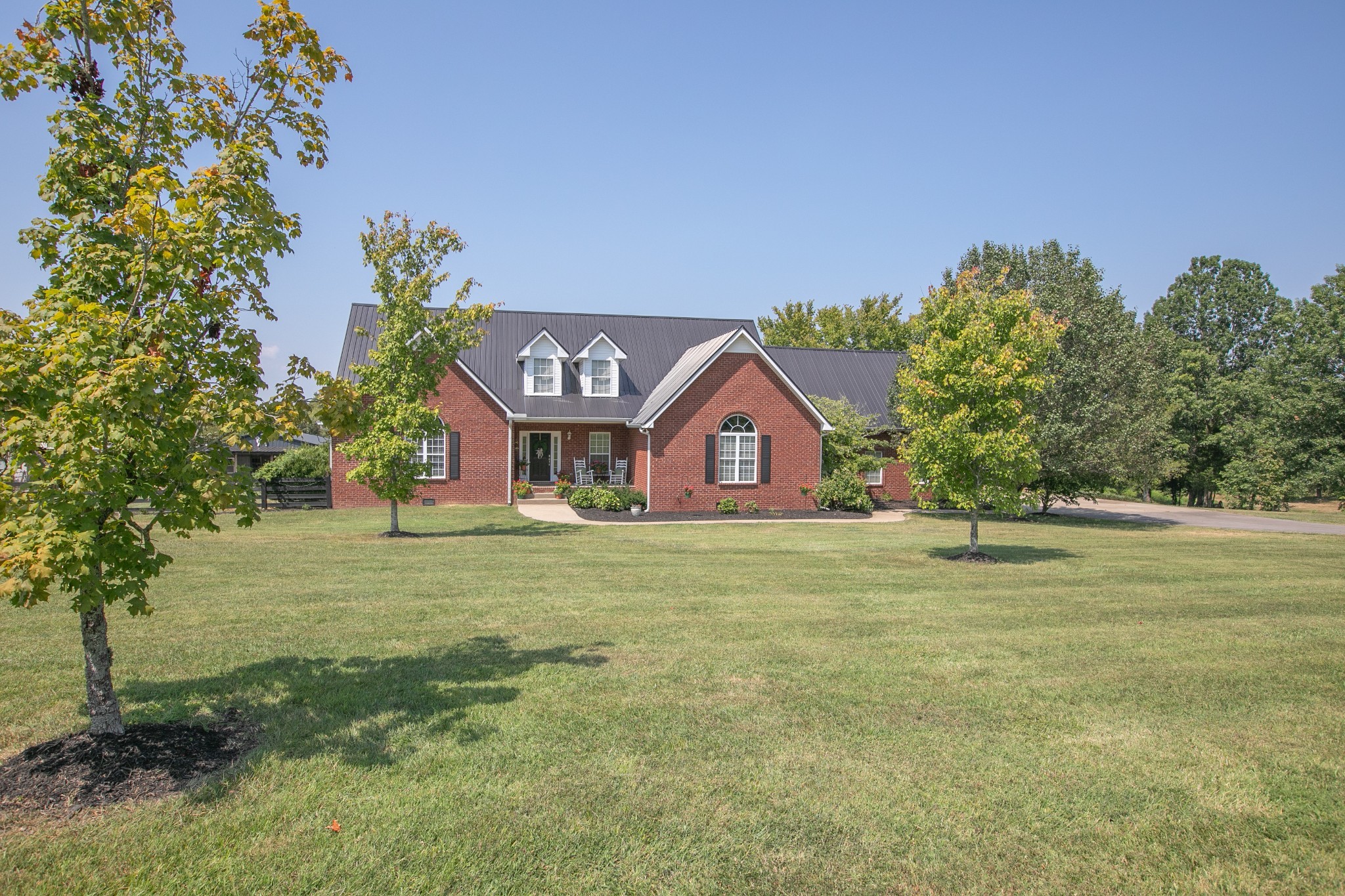 7285 North Milton Road Milton, TN 37118 - Photo 7 of 58 a front view of a house with garden