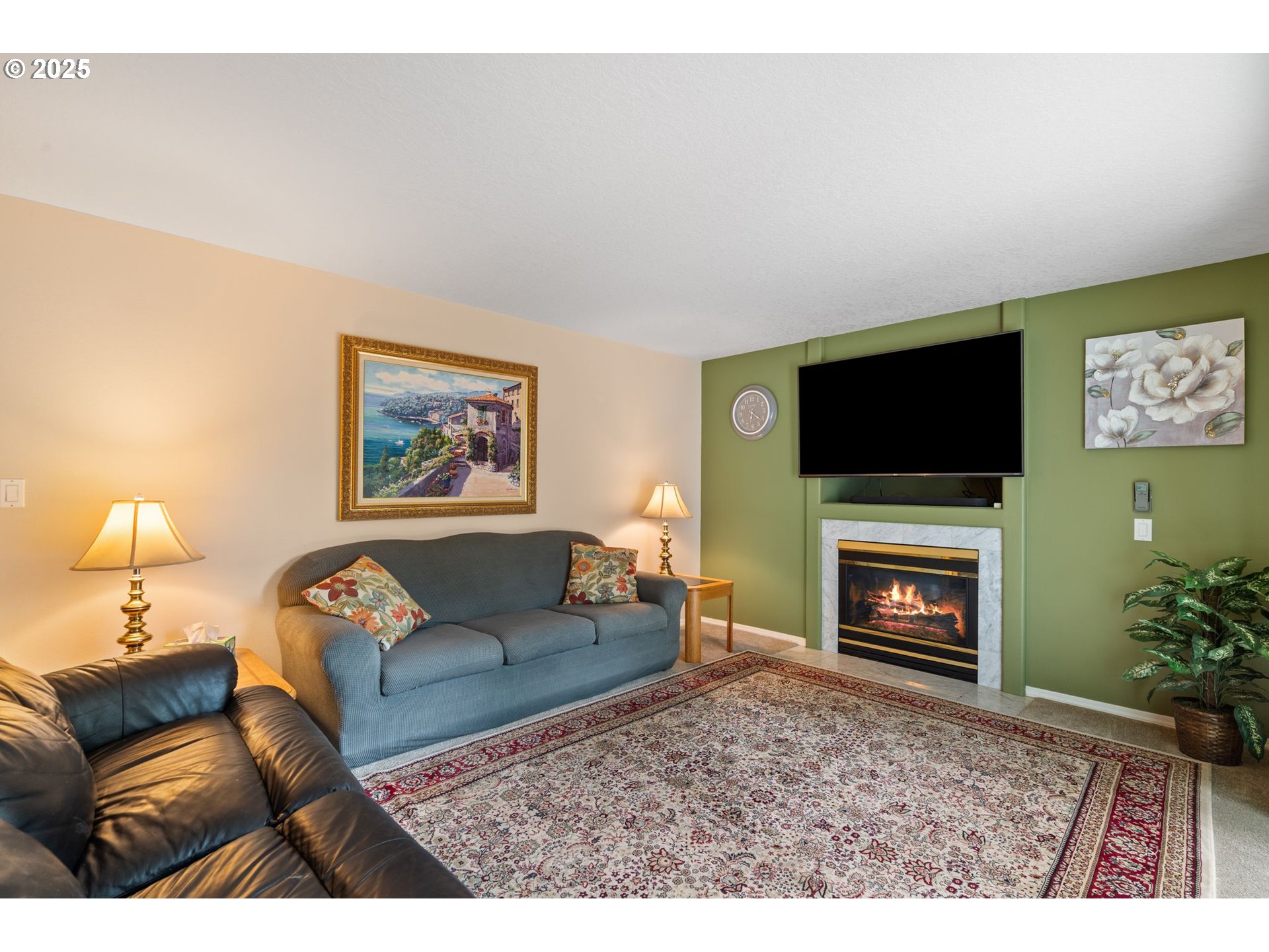 3010 Southwest Phyllis Drive Gresham, OR 97080 - Photo 17 of 48 a living room with furniture a flat screen tv and a fireplace