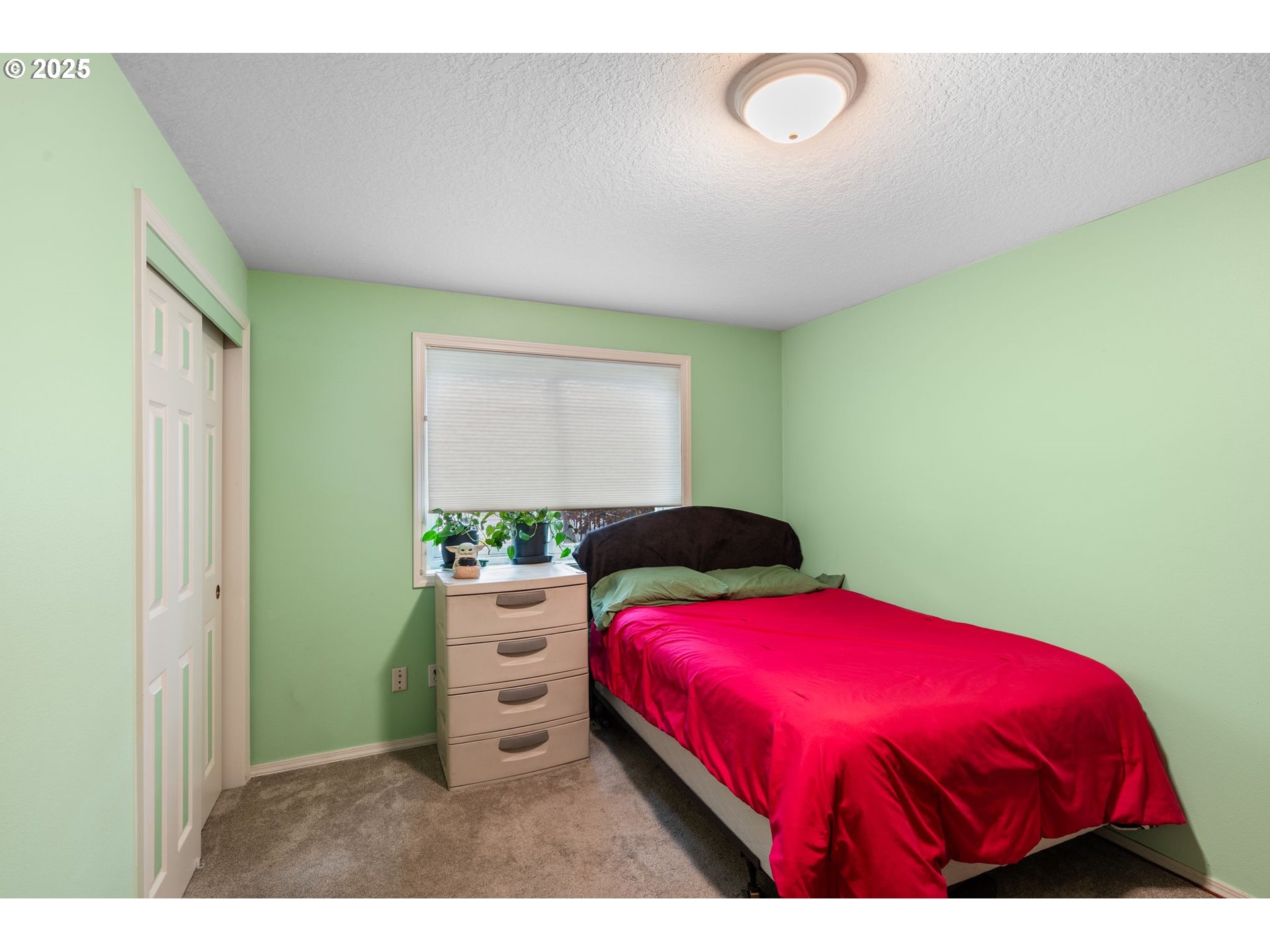 3010 Southwest Phyllis Drive Gresham, OR 97080 - Photo 21 of 48 a bedroom with a bed and a window