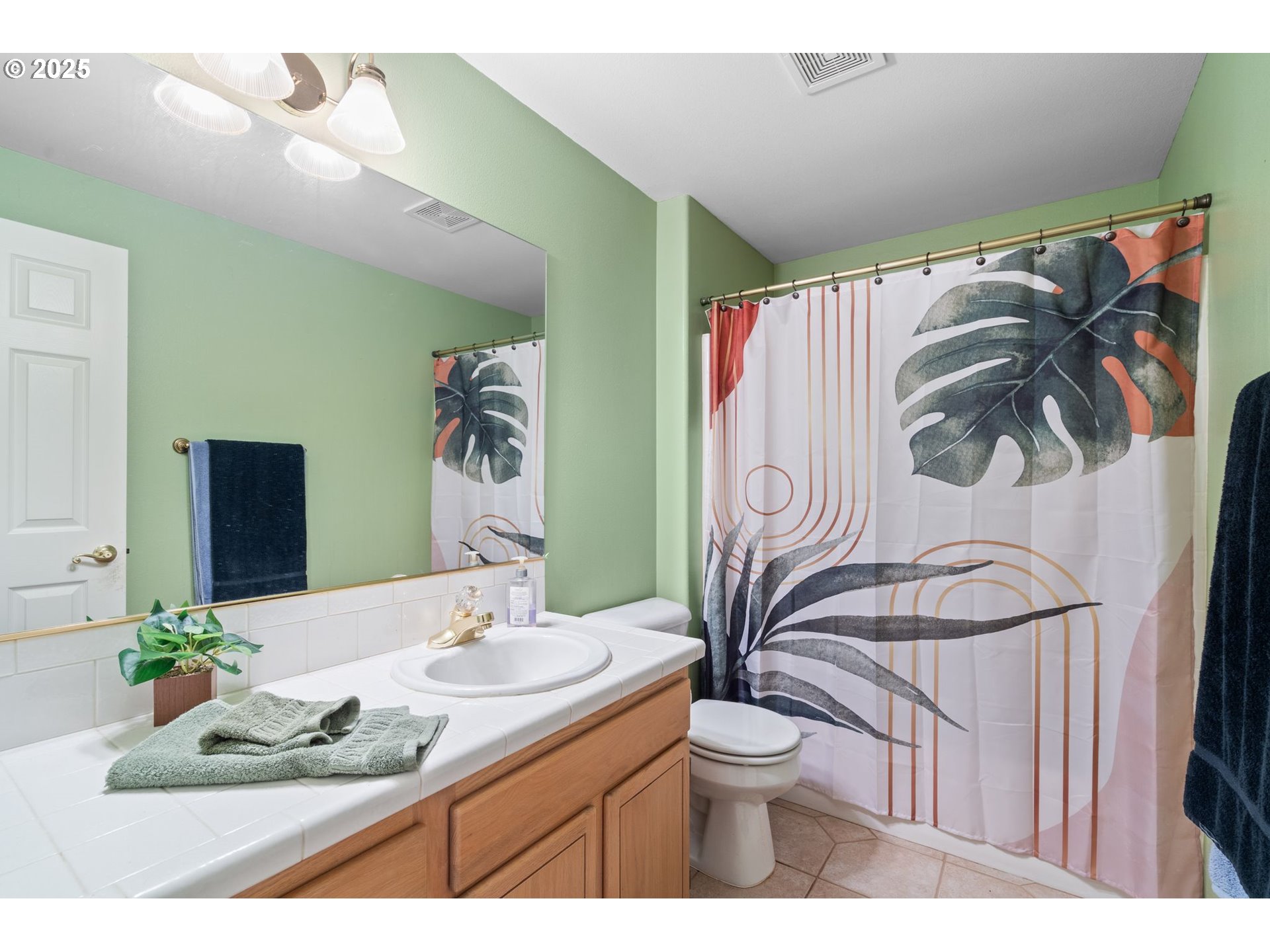 3010 Southwest Phyllis Drive Gresham, OR 97080 - Photo 23 of 48 a bathroom with a granite countertop sink and a mirror