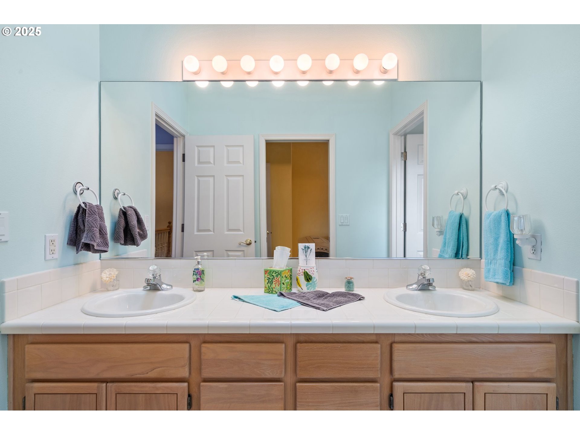 3010 Southwest Phyllis Drive Gresham, OR 97080 - Photo 27 of 48 a bathroom with a sink and a mirror