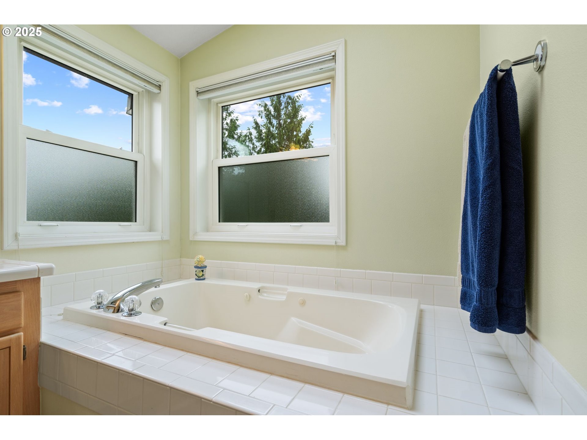 3010 Southwest Phyllis Drive Gresham, OR 97080 - Photo 37 of 48 a white bath tub sitting next to a bathroom sink
