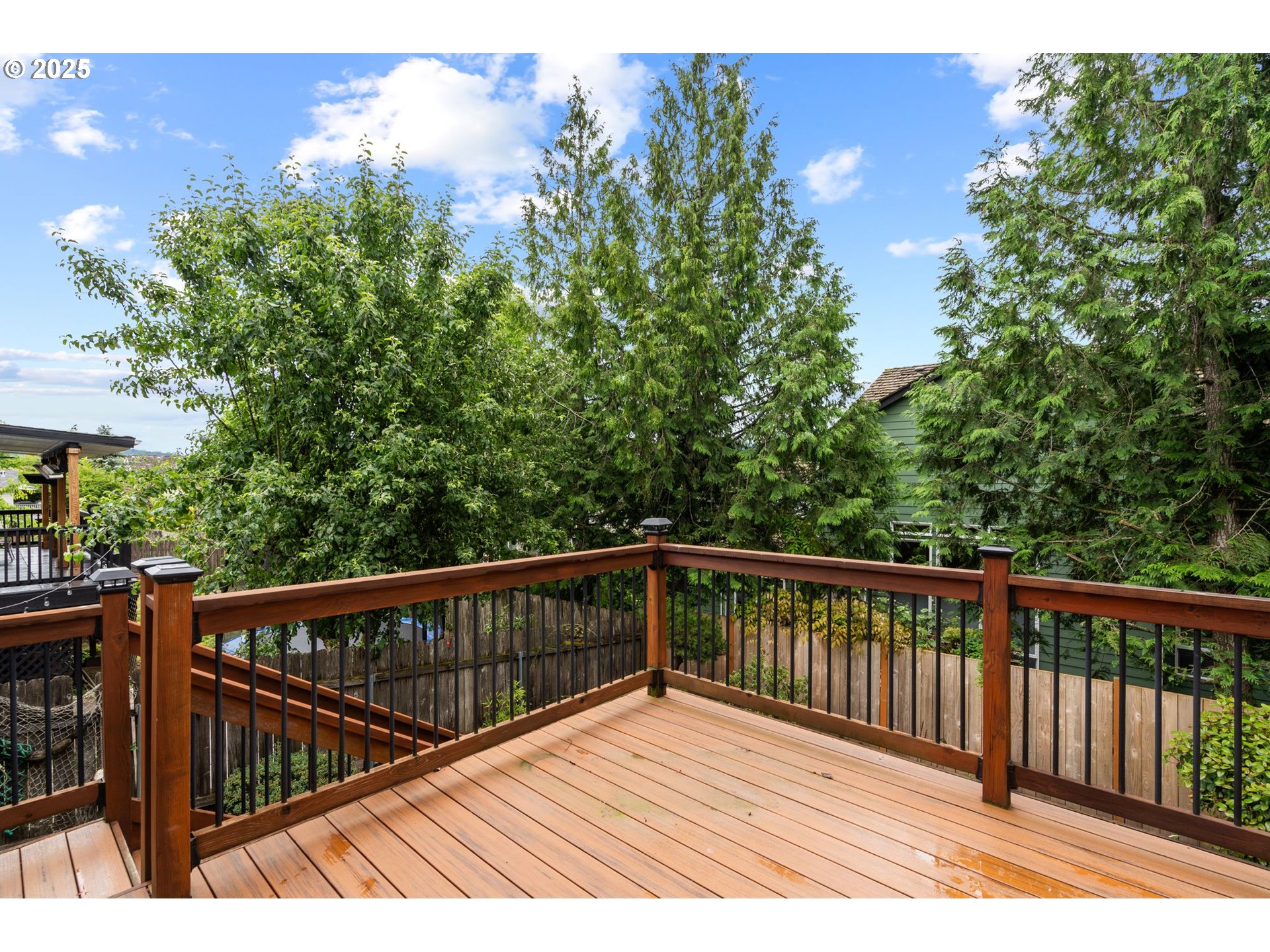 3010 Southwest Phyllis Drive Gresham, OR 97080 - Photo 38 of 48 a view of balcony with wooden floor and fence