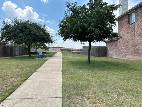 a view of a park with large trees