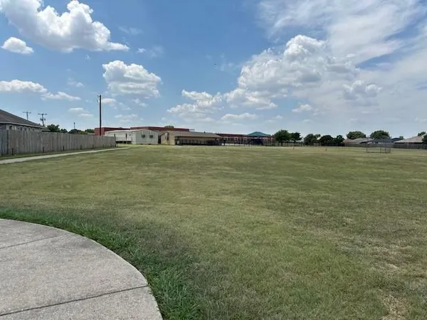 a view of a lake with a big yard